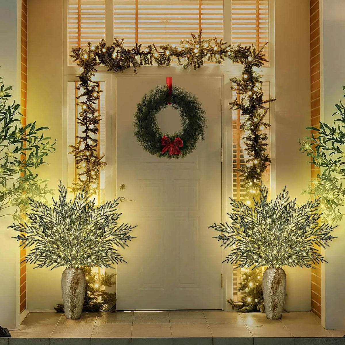 Lighted Norfolk pine branches in Christmas entryway
